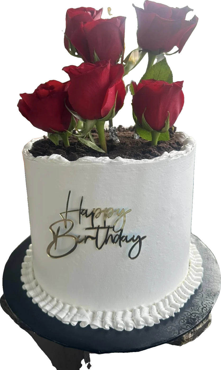 White cake topped with red roses