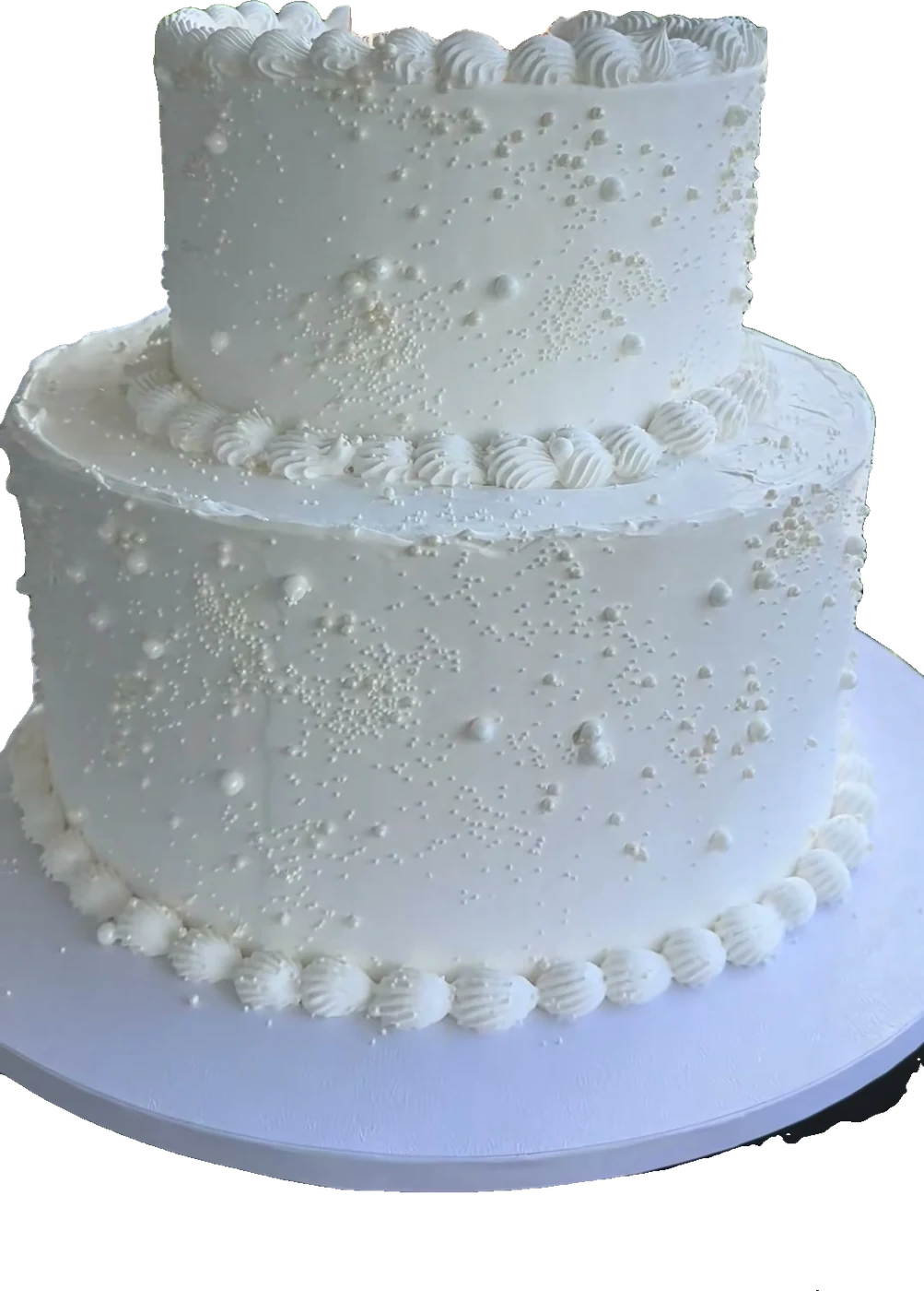 Two-tier white wedding cake with pearl details