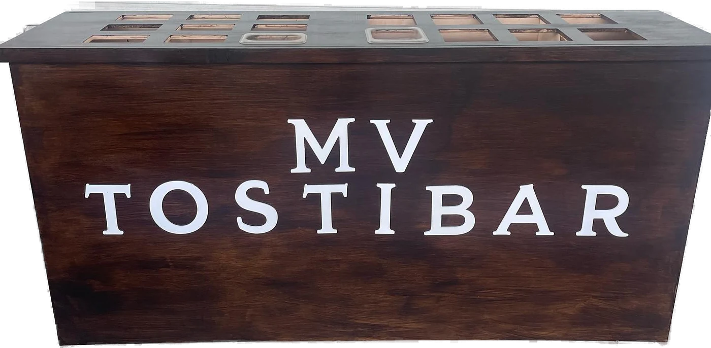 The MV Tostibar, a dark stained wood bar with white lettering