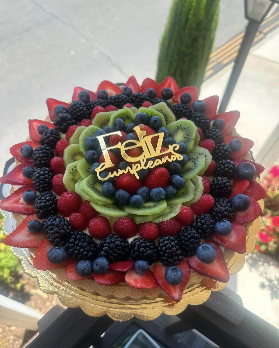 Fresh fruit tart with a Feliz Cumpleaños topper